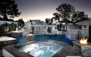 Universal Mini Pebble Jewels for Pools White Pool with water and fire features and stone hidaway