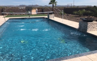 Universal Mini Pebble Jewels For Pools finish Pool with net, water feature and tile detail in bottom of pool