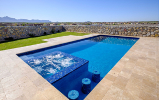 Finest Finish Sparkle Quartz Laguna pool with water feature and seating