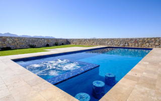 Finest Finish Sparkle Quartz Laguna pool with water feature and seating