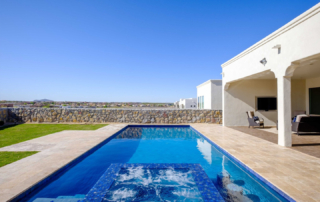 Finest Finish Sparkle Quartz Laguna pool with water feature and seating