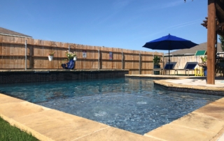 Jewels for Pools swimming pool with umbrella and fence