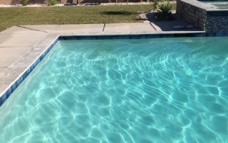 Finish Sparkle Quartz White Pool edge with blue tile trim