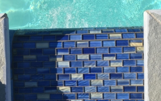 Finest Finish Sparkle Quartz White Spa water feature detail with blue tile