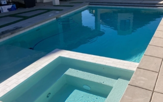 Sparkle Quartz Kool spa with white tile trim and pool