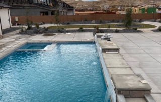 Sparkle Quartz Lakeside pool with decorative tile trim, steps and water feature