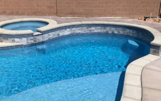 Sparkle Quartz Lakeside pool with ledge and spa with tile interior wall
