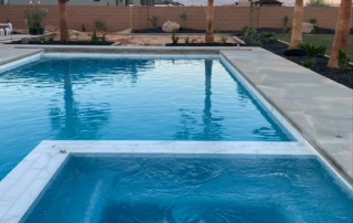 Sparkle Quartz Lakeside spa and pool with light tile trim