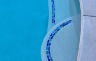 Sparkle Quartz White pool ledges with teal blue black