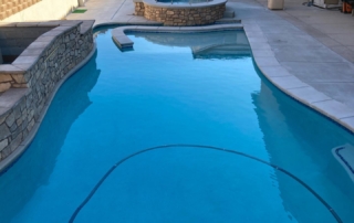 Sparkle Quartz White pool with baja ledge with teal blue black