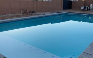 Sparkle Quartz White pool with blue tile detail with baja ledge and steps