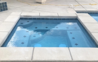 Sparkle Quartz spa with blue tile detail lakeside