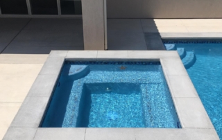Finest Finish Sparkle Quartz spa with pool steps in background