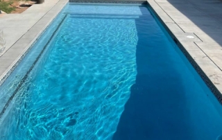 Finest Finish Sparkle Quartz Pacific pool with spa in backgrounFinest Finish Sparkle Quartz Pacific pool