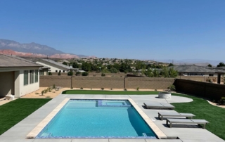 Finest Finish Sparkle Quartz White pool and spa with turquoise coFinest Finish Sparkle Quartz White pool and spa with deck chairs
