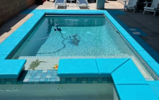 Finest Finish Sparkle Quartz White pool and spa with turquoise coping and mosaics