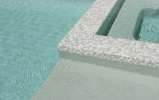 Finest Finish Sparkle Quartz Kool spa detail with small tile finish