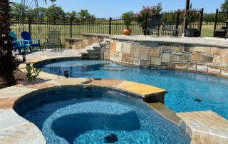 Finest Finish Sparkle Quartz Laguna rounded edge spa and pool with with stonework wall