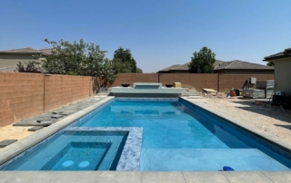 Finest Finish Sparkle Quartz Lakeside spa and pool with tile detail, baja shelf and water feature