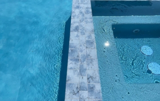 Finest Finish Sparkle Quartz Lakeside spa with tiled edge detail in blue