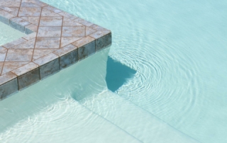 Finest Finish Sparkle Quartz white pool edge, tiled with steps