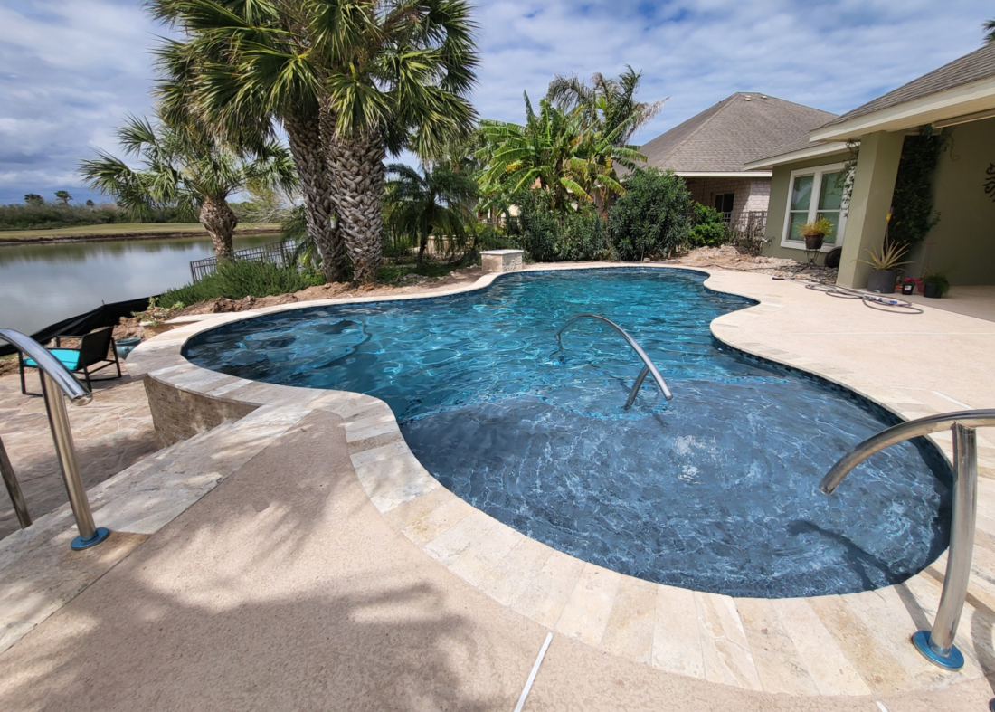 Island Series Serenity Blue pool with hand rail and baja ledge