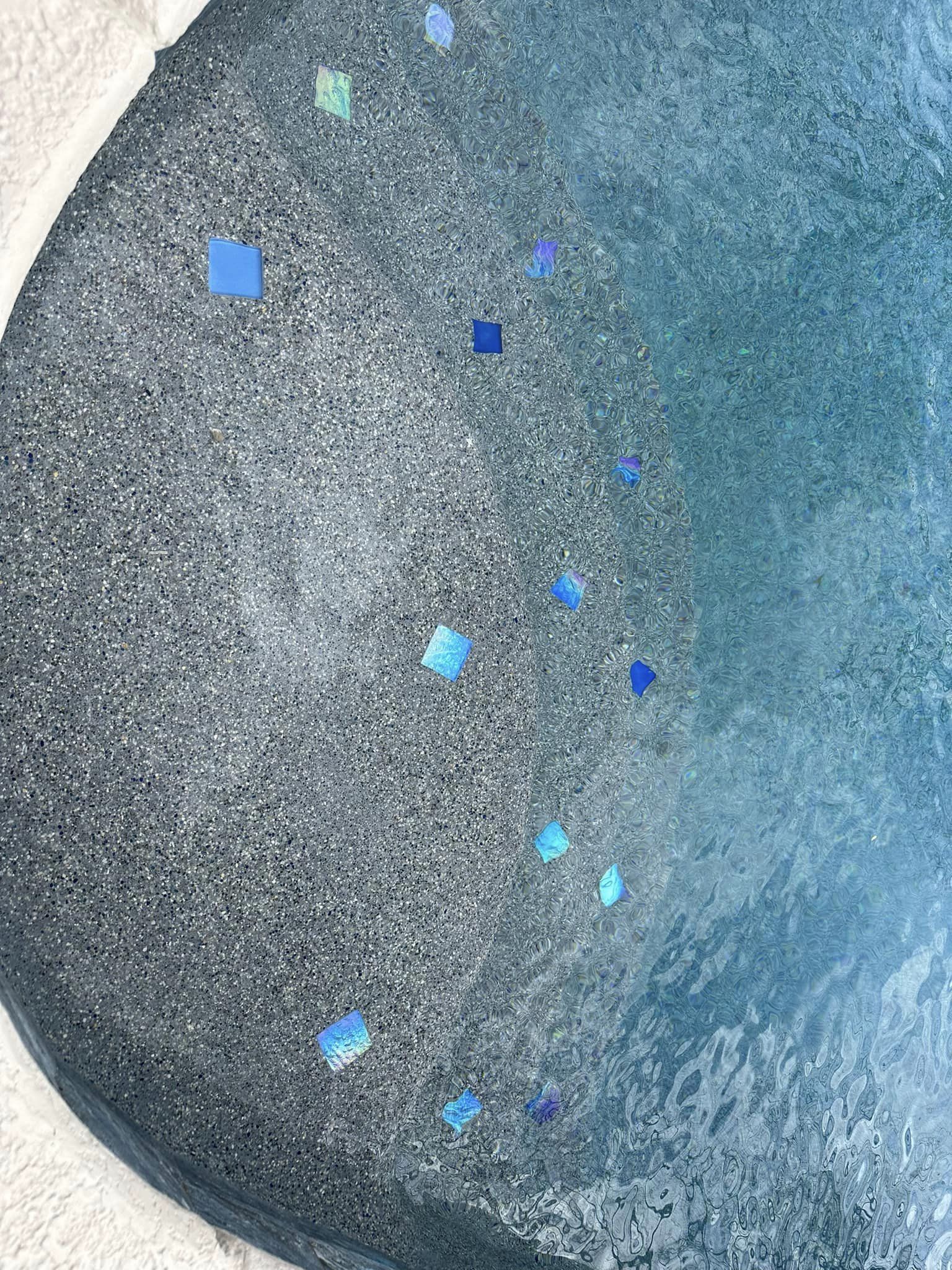 Universal Mini Pebble Series Tahoe pool steps with tile detail